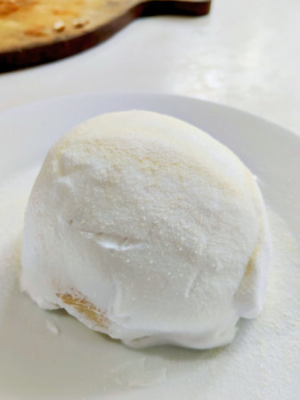 Delicious Thai Style Soft Milk Bread Topped with a Thick Layer of White Cream and Powder