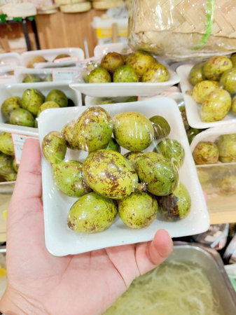 Small Tropical Green Mangoes Indonesian Delicacy Packed for Sale at a Traditional Market