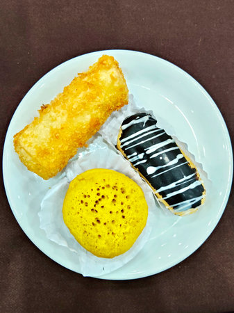Cake with black and white chocolate on white plate, Thailand.