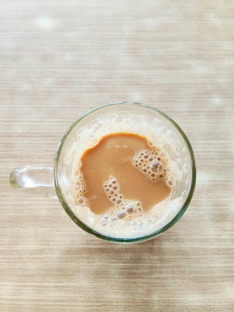 Traditional Malaysian Hot Milk Tea on Wood Tableの写真素材
