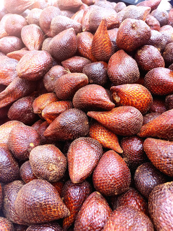 Fresh organic snake fruit salak background at traditional marketの写真素材