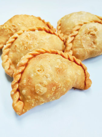 Fried dumplings on a white background, close-up