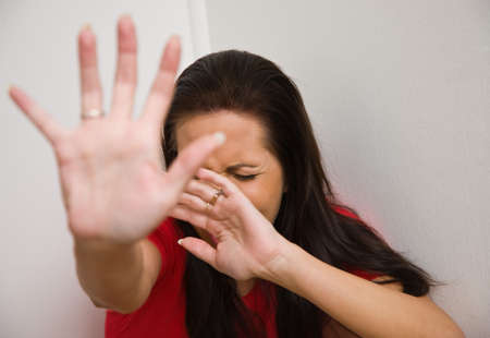 Timid woman symbol of violence in the family