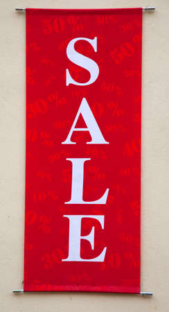 Close-up of red sale sign. Vertical.の写真素材
