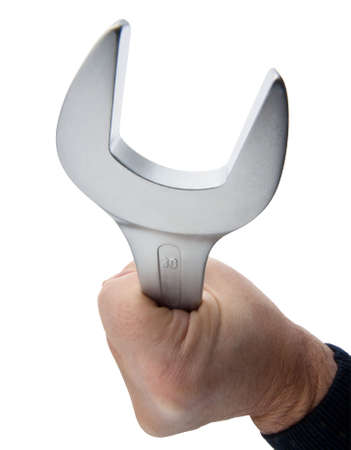 Close-up of adult holding wrench. Vertically framed shot.の写真素材