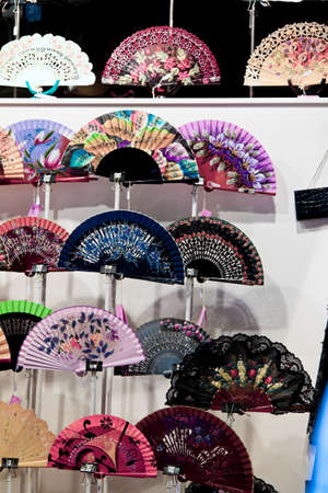 Colorful fans in Barcelona, Catalonia, Spain, Europe. Vertically framed shot.の写真素材