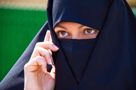 Example picture Islam. Muslim burqa is with obscured.の写真素材