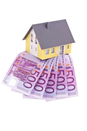 Euro notes and a model of a single-family dwellingの写真素材