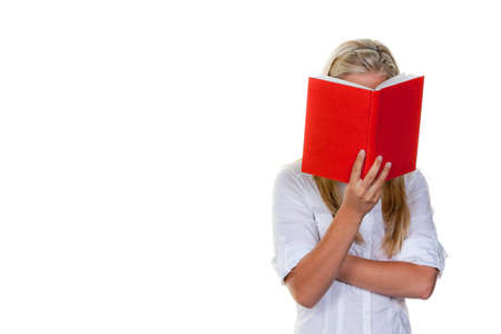 Young woman reading a book with red coverの写真素材