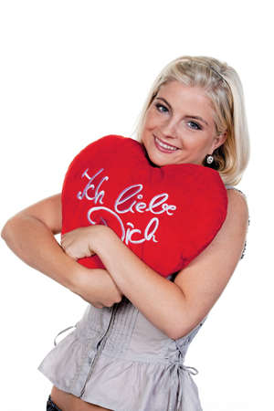 Young woman with cushion, I love you.の写真素材