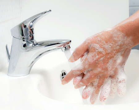 Woman washes with running water and soap hands. Protection from infection of the new flu H1N1. Woman washes with running water and soap hands. Protection from infection of the new flu H1N1.