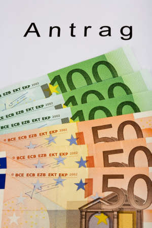 Application (in German) and Euro banknotesの写真素材