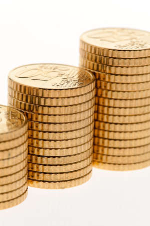 Some piles of coins on white background ?の写真素材