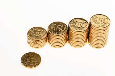 Some piles of coins on white background ?