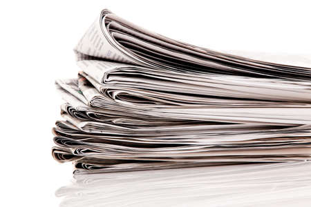 Old newspapers and magazines in a pileの写真素材