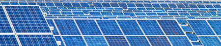A solar system for solar energy against a blue sky with clouds