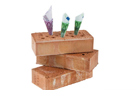 Example picture house construction, financing, building society. ? bricks and money.の写真素材