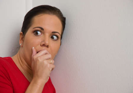 Young woman is afraid of violence in the familyの写真素材