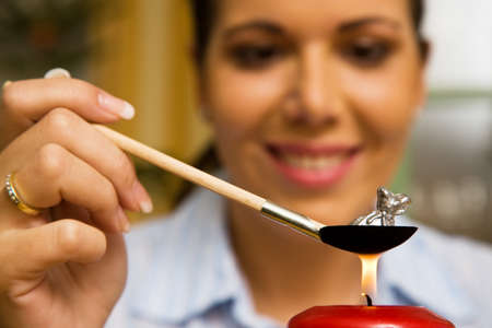 Young woman on New Year's Eve when pouring leadの写真素材