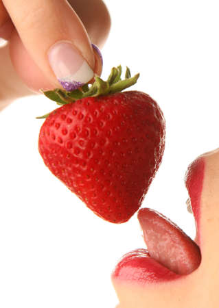 Young Woman with strawberries on a white background. Close-upの写真素材