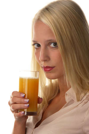 Young woman drinking a fruit juice. Orange juiceの写真素材