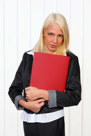 Young woman with Application folder prior to the interviewの写真素材