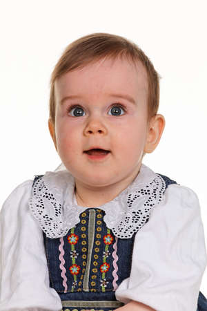Small happy child - baby sitting on a blanketの写真素材