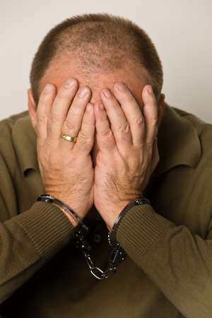 Man handcuffed. Symbol for detention and removalの写真素材