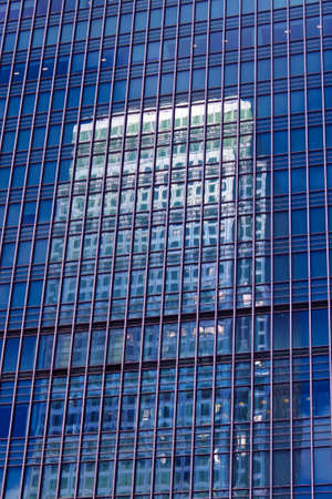 Windows on a facade of a modern office buildingの写真素材