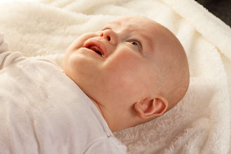 Face and portrait of a crying little babies. Sad babyの写真素材