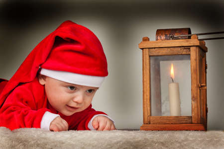 Little baby dressed as Santa Claus. Infant as Santa Clausの写真素材