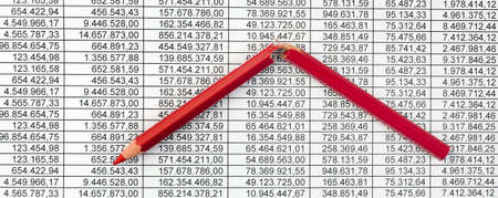 A red pen on a balance sheet