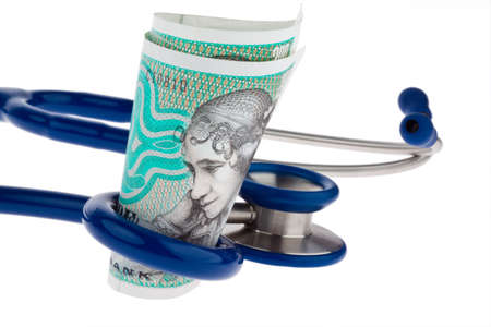 Danish crowns. Currency from Denmark in Europe. Stethoscope. Health costs.の写真素材