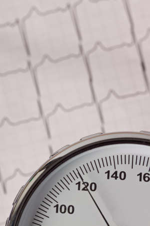 Blood pressure measurement and ECG curve. Sickness caused by high blood pressure.