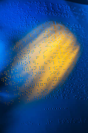 A book written in Braille. Braille for the blind.