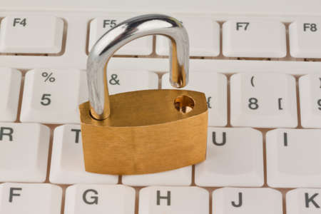 A padlock on a computer keyboard. Data security and protection.