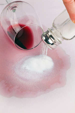 A glass of red wine which turned empty. Tip of salt.の写真素材