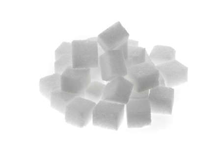 Many pieces of sugar for a sweet isloiert on white backgroundの写真素材