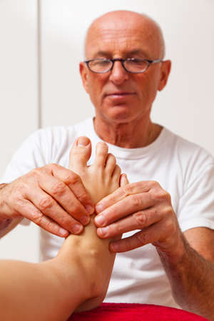 Relaxation, peace and well-being through massage. Reflexologyの写真素材