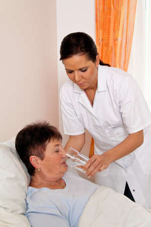 a nurse in aged care for the elderly in nursing homesの写真素材