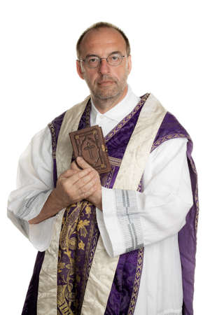 a Catholic priest with a bible in worshipの写真素材