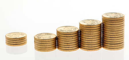 Some piles of coins on white background ?の写真素材