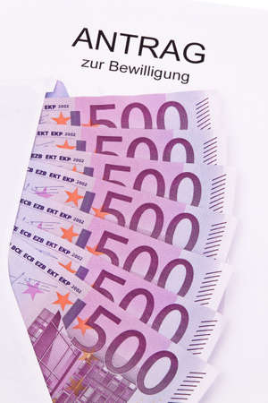 Many Euro notes and application. On white backgroundの写真素材