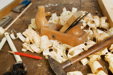 A plane in a carpentry workshop. Tools as a carpenter.