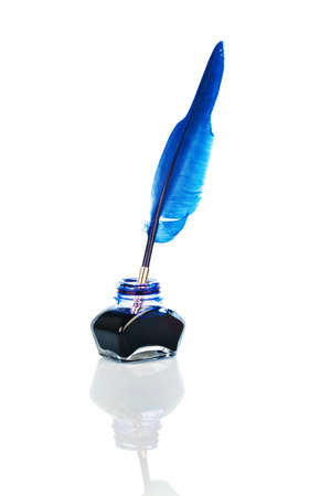 A blue pen with an ink bottle on white backgroundの写真素材