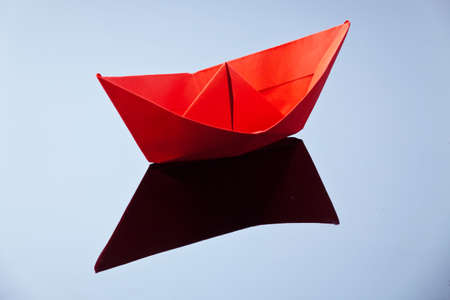 A ship made of paper folded. Photo icon longing for arts and crafts.