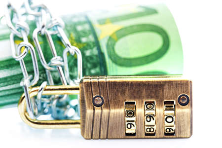 More than 100 â¬ notes with chain and padlock.の写真素材