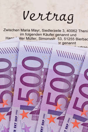 many euro banknotes and contract. notary costsの写真素材