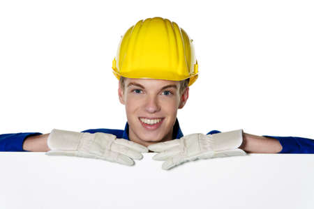 an apprentice / trainee as a craftsman with a blank panel