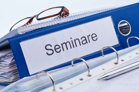 an icon image for further education, training and adult education. folder and documents in a seminarの写真素材